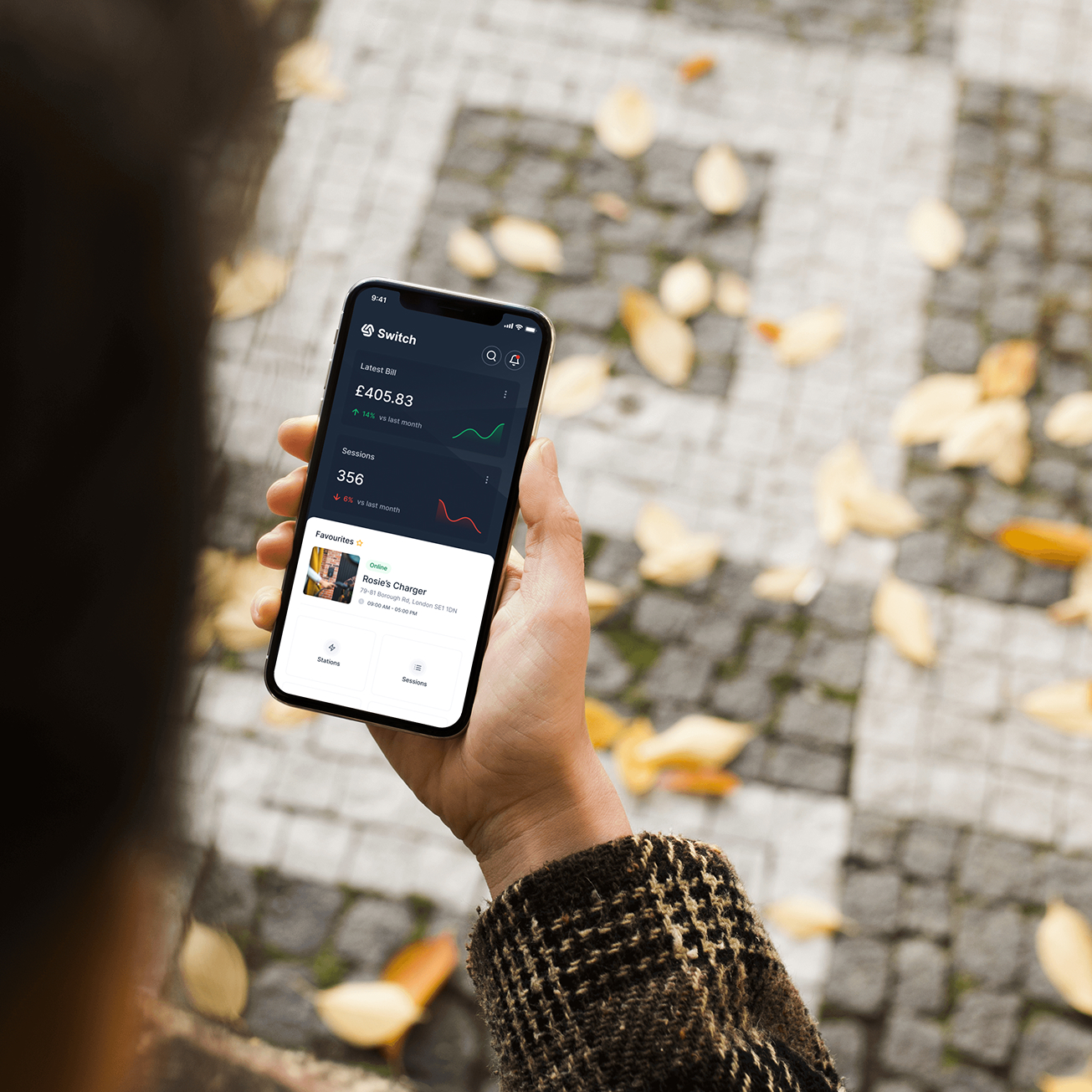 Person holding a smartphone showing the Switch app with latest bill £405.83, 356 sessions, and a favorite location called Rosie's Charger.